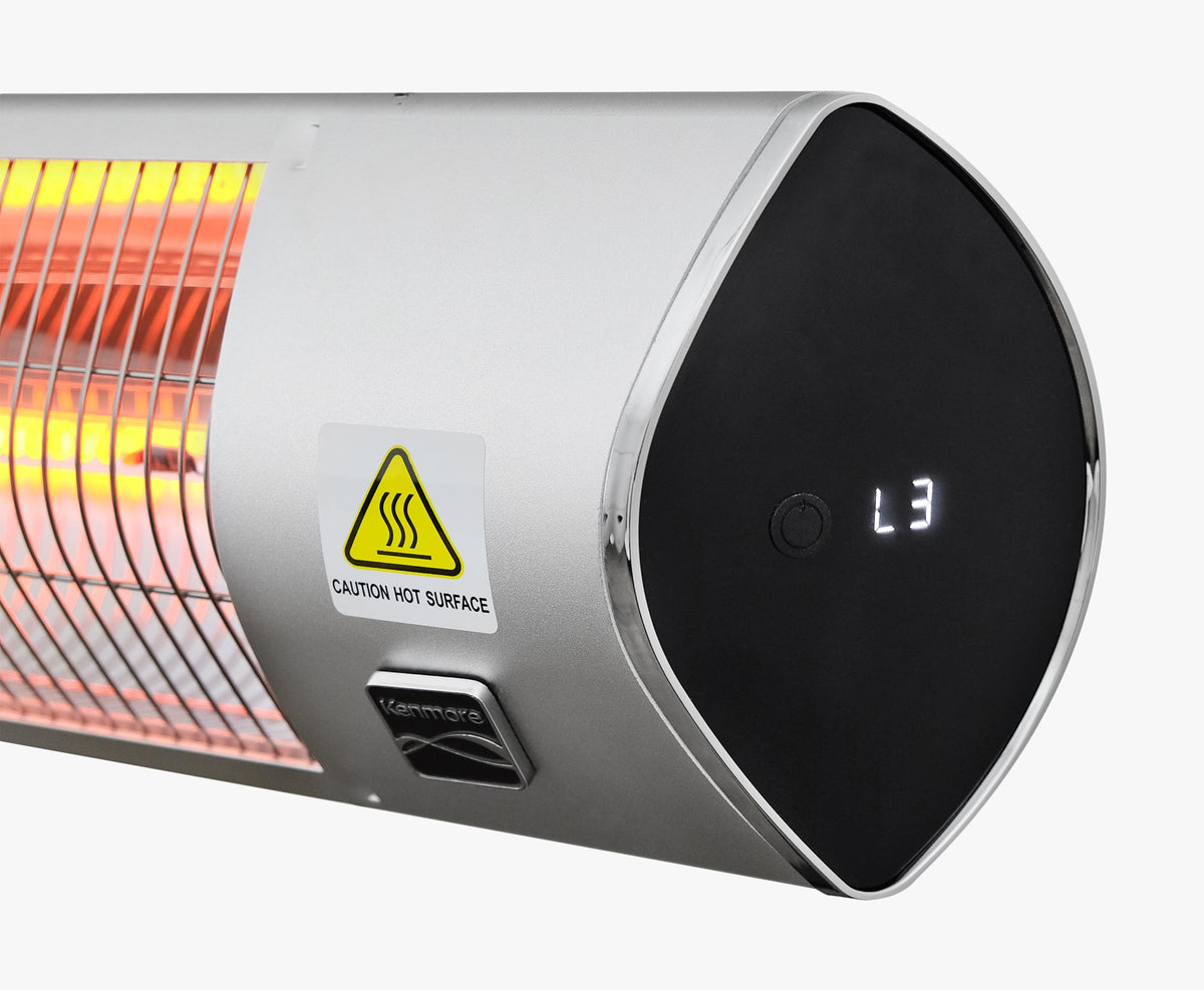 Close-up of the heater end cap showing the L3 power-level display, Kenmore badge and caution hot surface label